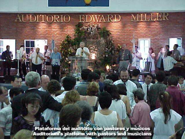Auditorium's platform with pastors and musicians